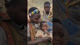 Hadzabe tribe women raise their children in the forest