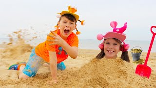 Adriana and Ali on the beach! Playing with Sand and other Kids Toys Stories