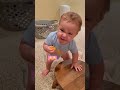 hilarious baby tastes kumquat for first time 😖😂 shortsvideo funnybaby rawvegan