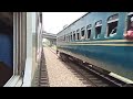 a local u0026 intercity train crossing at bangabandhu hi tech city station.