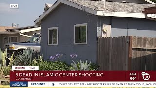 Authorities await search warrant outside suspect's home