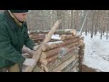 building a warm and cozy winter shelter living in a forest house