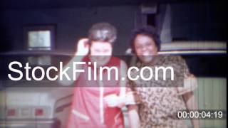 1969: African and caucasian women are neighbor friends.  CARMEL, INDIANA