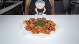 Making onion bhajia or onion bhaji - delicious crunchy snack or starter