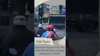 Người đàn ông trùm kín mít, bấm đèn đỏ khiến xe dừng không kịp ở TPHCM #vietnam #tintuc #giaothong