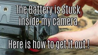 My Camera battery is stuck inside my camera  here is how to get it out !