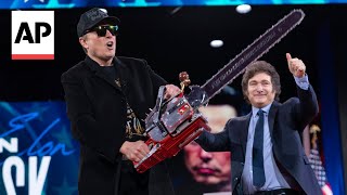 WATCH: Elon Musk waves chainsaw on stage at CPAC