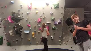 Random kid photobombs rock climbing on crazy overhang