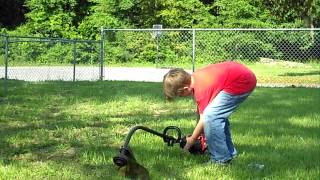 8 Year Old Wilson Hulett Demonstrates Gas String Trimmer