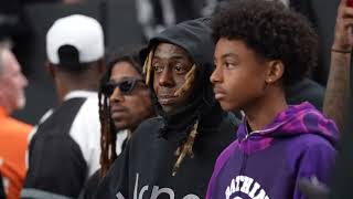 Lil Wayne at the Raiders vs. Steelers NFL game with his son Kameron Carter