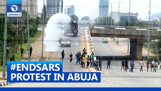 Police Fire Teargas, Water Canon At #ENDSARS Protesters In Abuja