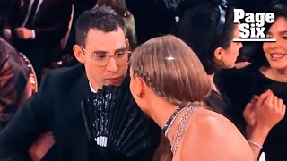 Taylor Swift covers mouth with fan at Grammys 2024 after viral Golden Globes gossip session #shorts