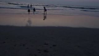 Mini playing in sand on Mandrem beach | children playing in mud on beach | Mandrem Goa