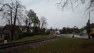 Czech railcar ČD 854-222 passes the Pražská railway crossing in Třebíč