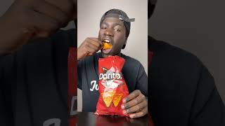 Black man eats Doritos chips for the first time