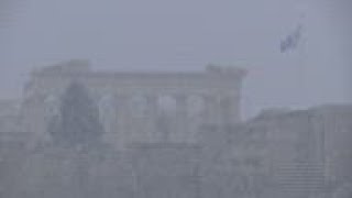 Severe weather dusts Athens with layer of snow