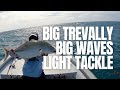 Fighting a big trevally and big waves on light tackle