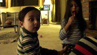 Rhadean and Arzene sharing lollipop.MP4