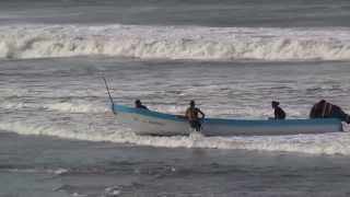 Nicaragua , Las Penitas , Beaching a Fishing Panga in the surf