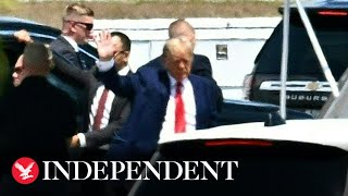 Donald Trump exits plane as he arrives in New York to face arrangement