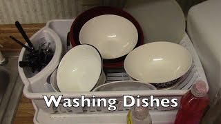 Rennell Reed Washes Dishes