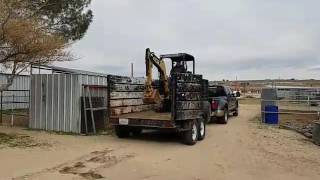 Unloading mini excavator