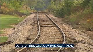 DOT urges people to stop trespassing on railroad tracks, driving around train gates