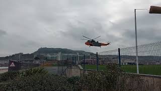 flight of the Seaking @DevelopingAssets Heli-opps Portland Dorset.