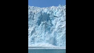 Dramatic footage shows huge chunk of glacier dropping into the sea and triggering a wave in Alaska