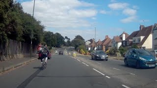 Cyclist Carries Lawnmower On Back