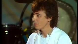 Bill Wyman With Professor Stanley Unwin In UK TV's 'Weekend In Wallop' (1984).