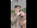 couple standing under umbrella enjoying the rain shorts youtubeshorts rainsounds umbrella