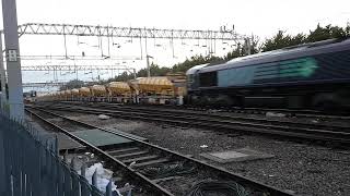 The very lengthy Network Rail HOBC (High Output Ballast Cleaner) powers through Colchester at speed