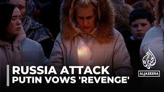Putin vows 'revenge': Russians mourn dozens of victims