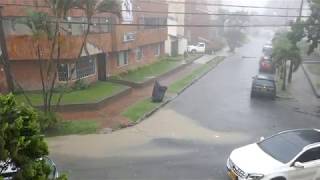 Thunderstorm, hail, heavy rain and flooding streets in Medellin, Colombia