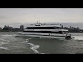 seastreak high speed ferry leaving wall st. nyc