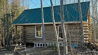 Log Cabin Built on an Off Grid Land , Building doors in the Cabin,working in the