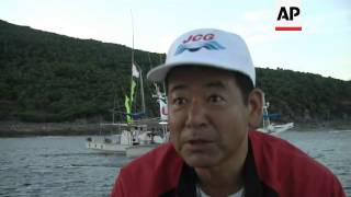 Fleet of fishing boats arrive at disputed islands for memorial ceremony