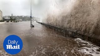 Waves pound the seafront at Exmouth during Storm Callum