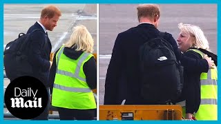 Touching gesture: Prince Harry comforts airport worker after Queen Elizabeth death