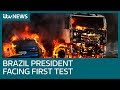 Brazil's hardline president Jair Bolsonaro faces fiery first test of crackdown on gangs | ITV News