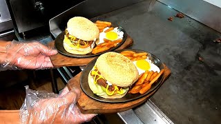 Bacon egg cheeseburger on sizzling plate