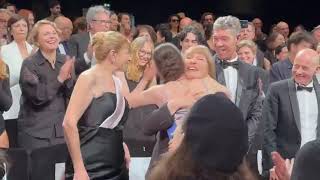 Valeska Grisebach hugs cast after The Dreamed Adventure premiere at Cannes