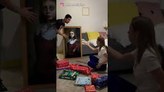 Woman scared the shit out by prank ghost picture