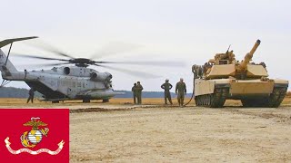 US Marines refueling M1A1 Abrams tanks using the CH-53E Super Stallion.
