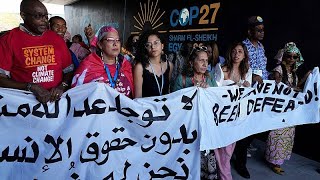 Hundreds of people march through UN climate conference in first big protest at COP27