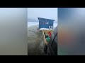 This guy pushes water as he pulls this ice shack off the lake