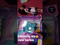 opening my new barbie and sowing the barbie's dressing things and make-up kits