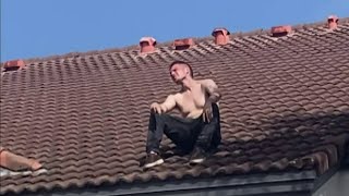SWAT standoff with fugitive on building's roof ends with US Marshal's arrest
