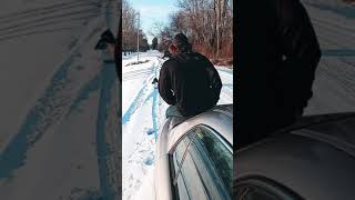 sledding on a car hood